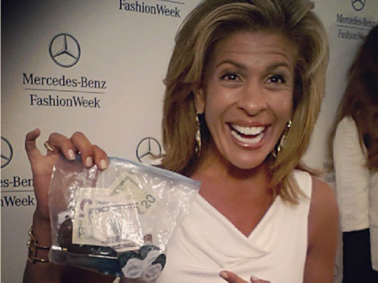 Hoda, showing off her "clutch" on the red carpet. 