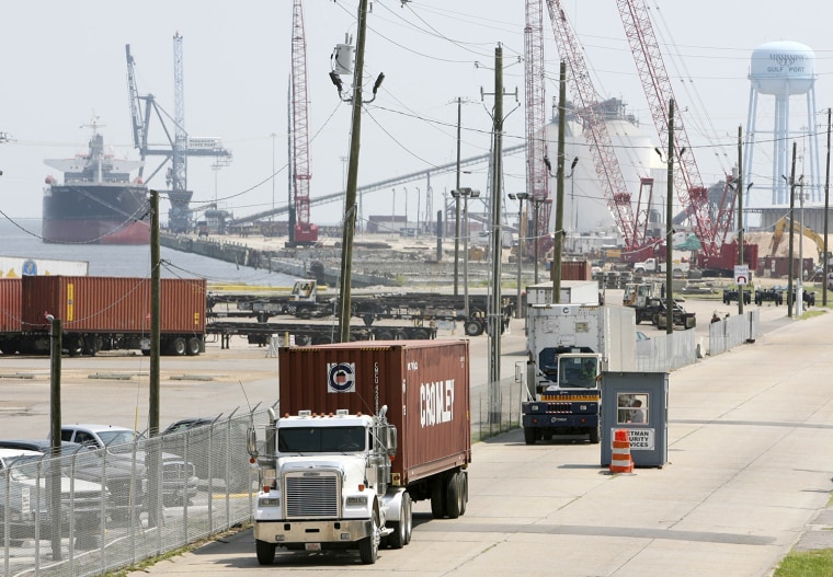 This Aug. 28, 2008 file photograph shows trucks hauling shipping containers out of the Mississippi State Port at Gulfport, Miss., in preparation for Gustav. Containers from the port were turned into battering rams causing extensive damage during Hurricane Katrina, prompting port officials to devise an evacuation plan for the containers.