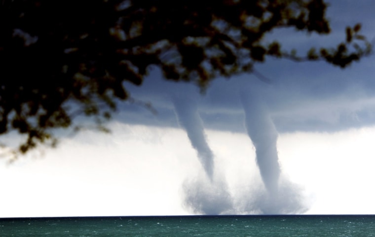 A pair of water spouts form on Lake Michigan southeast of Kenosha, Wis. on Sept. 12.