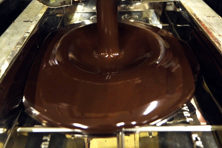 Chocolate prices are on the rise, just in time for the holidays. A picture shows hot chocolate being moulded at the Barry Callebaut chocolate factory ...