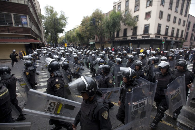 Striking teachers in Mexico cleared out by riot police