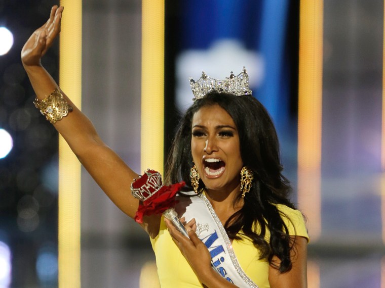 Miss New York Nina Davuluri walks down the runway after winning the the Miss America 2014 pageant, Sunday, Sept. 15, 2013, in Atlantic City, N.J. (AP ...