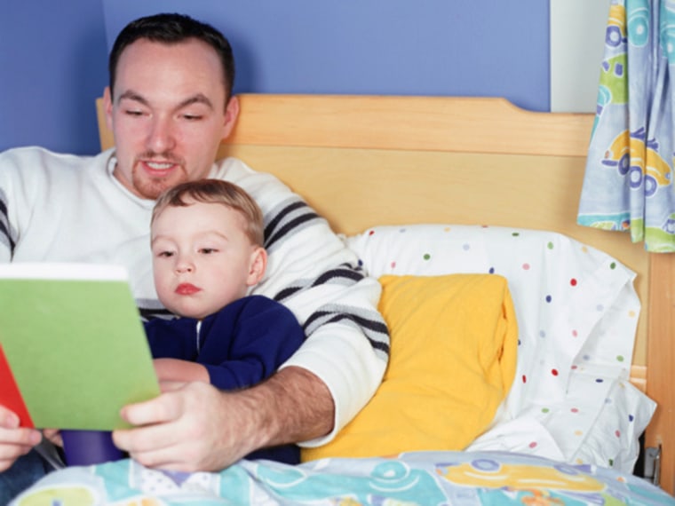 Father reading book to son (4-5) in bedroom; photodisc, stock photo, dad, son, kid, child, parent, bedtime, bed, sleep, tuck in, book, read, story