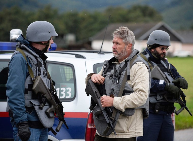 epa03870941 Police closed a road near melk after a hostage-taking and shooting in Lilienfeld, Austria, Tuesday.