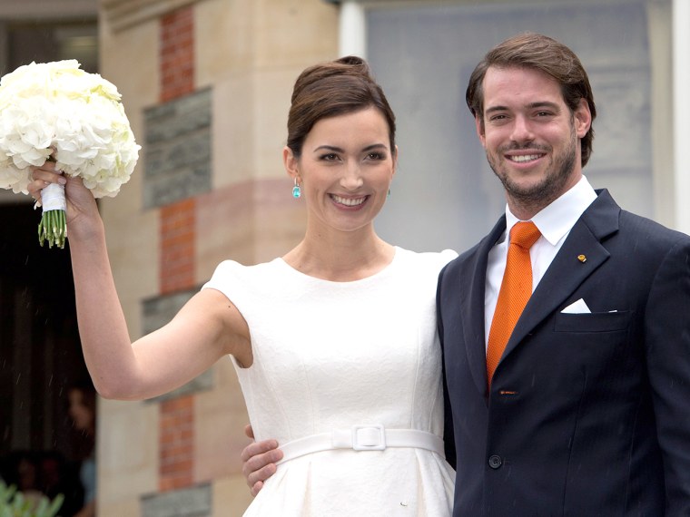 Prince Felix of Luxembourg (R) and his wife Claire Lademacher (L) pose for photographs after their civil wedding ceremony.