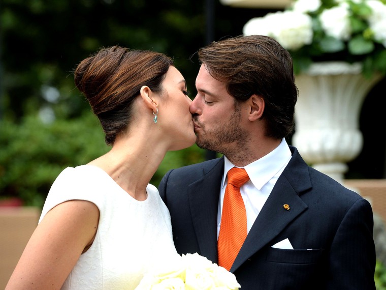 Prince Felix of Luxembourg (R) and German student Claire Lademacher kiss while posing for pictures after their Civil Wedding Ceremony at Villa Rothsch...