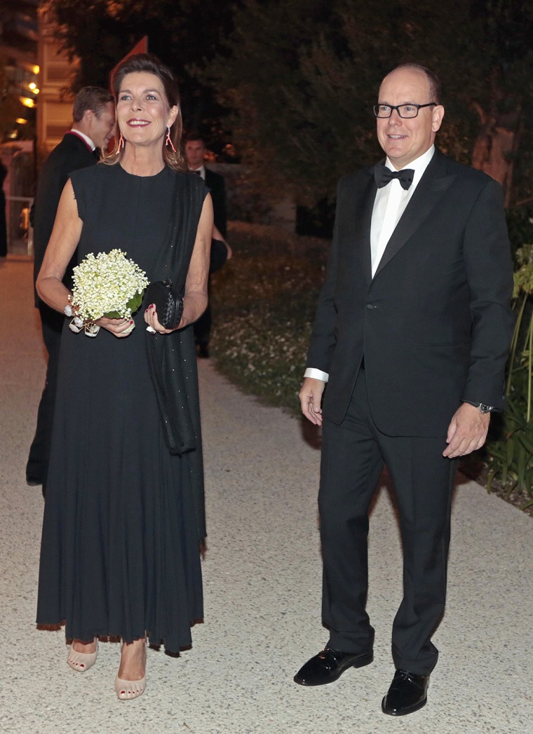 Image: Prince Albert II of Monaco (R) and his sister Princess Caroline of Hanover arrive at the fundraising dinner for the new national museum, in Monaco Sep...