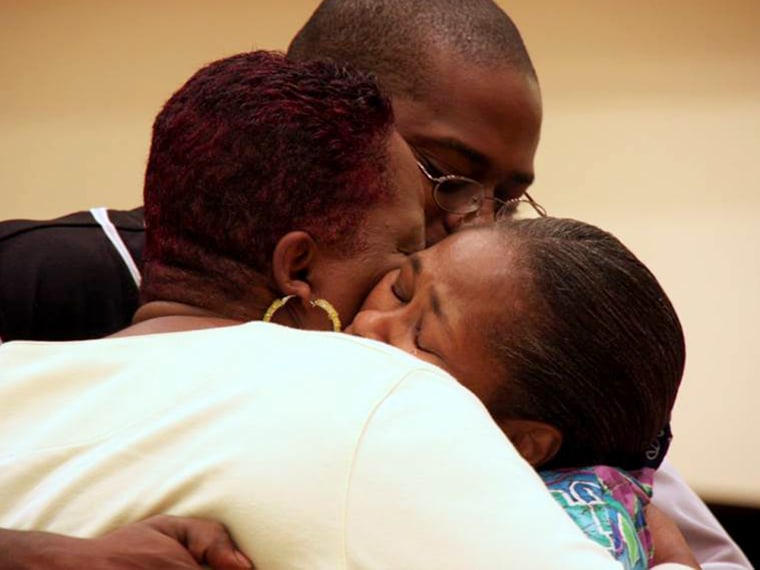 Oshea embracing his two mothers...his 'spiritual mother' Mary Johnson, and his biological mother Carolyn Green-James, in Sept. 2010.