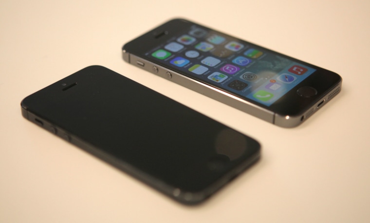 An iPhone 5S next to an older iPhone 5 at Apple's launch event in Cupertino, Calif. on Sept. 10.