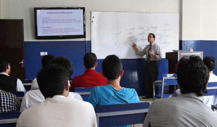 Shahed Shams, an Afghan professor, teaches business administration at Kardan University in Kabul, Afghanistan, on Sept. 10.