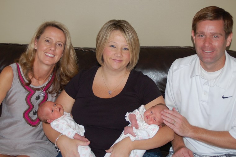 Carolyn and Sean Savage with twins Isabella and Reagan, and surrogate Jennifer Onash.