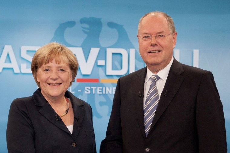German Chancellor Angela Merkel -- and her popular necklace -- shakes hands with challenger Peer Steinbrueck prior to a television debate in Berlin on Sept. 1. Germans go to the polls on Sunday.