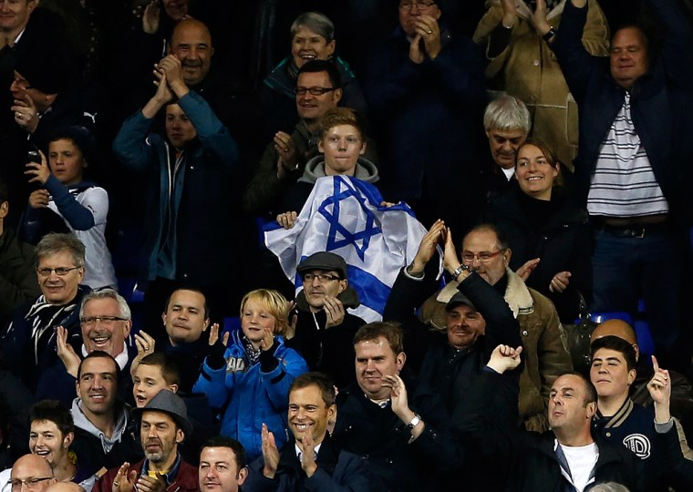 A Tottenham Hotspur fan holds an Israeli flag during a Europa League match at the club's White Hart Lane stadium in November 2012. The team has many Jewish fans but the use of the word