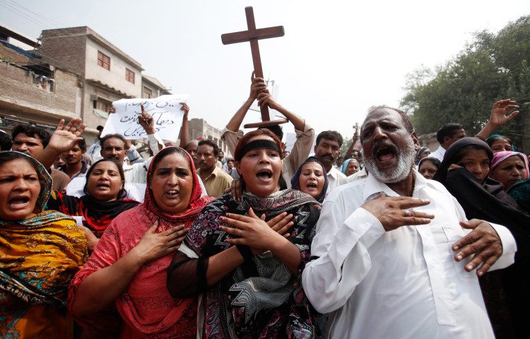 Members of the Pakistani Christian community chant slogans during a protest rally to condemn Sunday's suicide attack on a church in Peshawar September 23, 2013. A pair of suicide bombers blew themselves up outside the 130-year-old Anglican church in Pakistan after Sunday mass, killing at least 78 people in the deadliest attack on Christians in the predominantly Muslim country. REUTERS/Fayaz Aziz (PAKISTAN - Tags: CIVIL UNREST RELIGION TPX IMAGES OF THE DAY)
