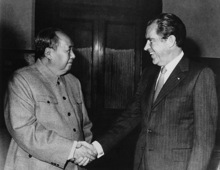 Chinese communist party leader Mao Zedong, left, and U.S. President Richard Nixon shake hands as they meet on Feb. 21, 1972. Nixon's visit was the first time an American president had visited the People's Republic of China.