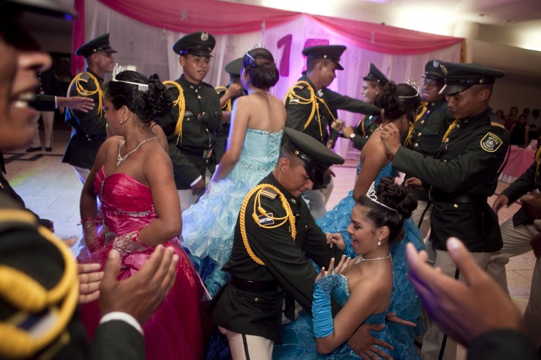 Nicaraguan girls suffering from cancer dance with army cadets during a quinceañera party in Managua, Nicaragua, on Sept. 21.