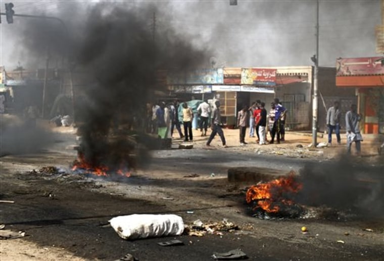 Protesters burn tires and close the highway to northern cities amid a wave of unrest over the lifting of fuel subsidies by the Sudanese government, in...