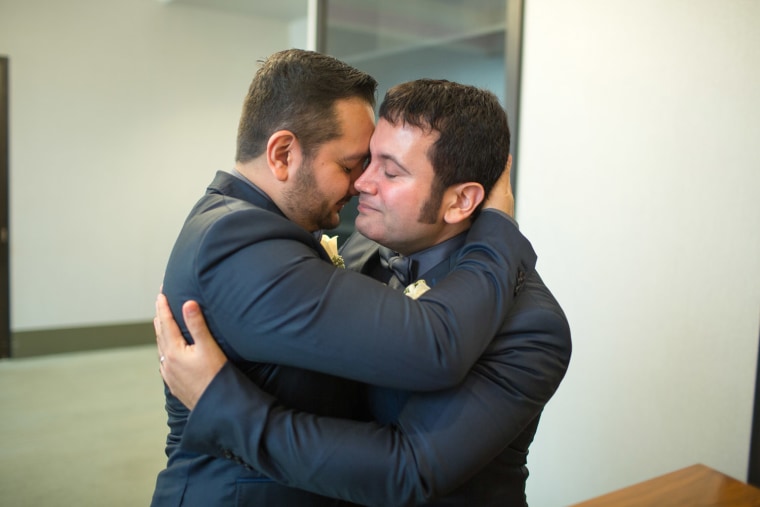Richard Hurtado, left, and his husband Hugo Rendon embrace after a wedding officiant pronounced them married at the Office of the City Clerk in New York City on Tuesday, Sept. 17.
