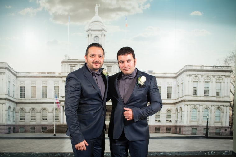 Hurtado, left, and Rendon pose in the photo studio at New York's Office of the City Clerk, where they were married.