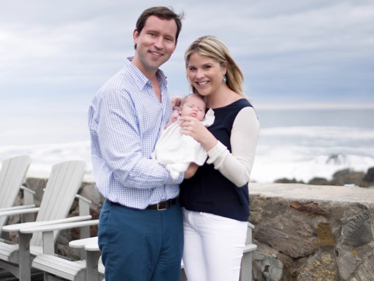 Jenna and her hubby pose with the new addition to their family.