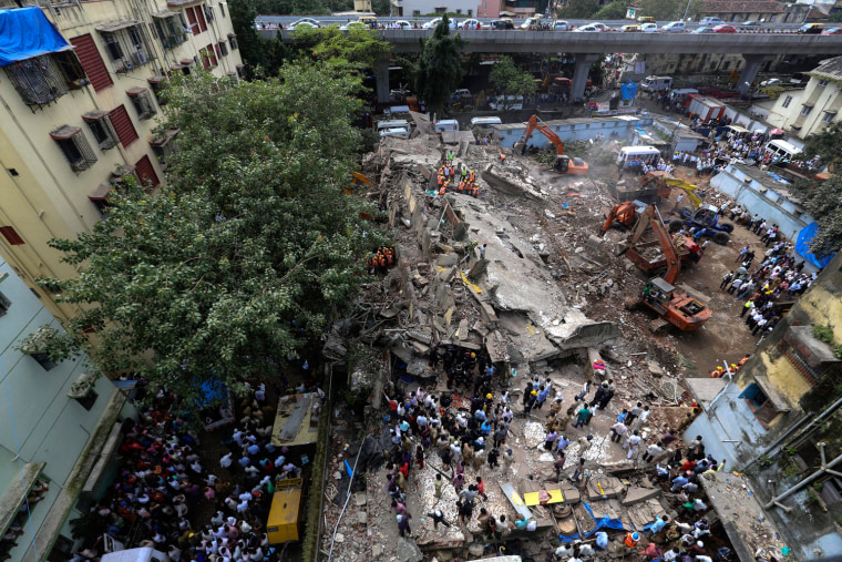Rescue work in progress after a four-story residential building collapsed in Mumbai on Sept. 27.