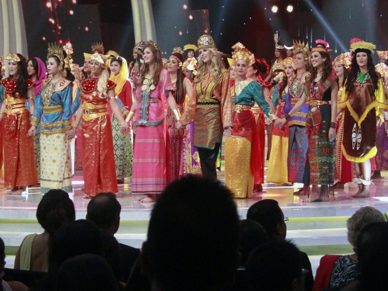 In this Sunday, Sept. 8, 2013 photo, contestants wear traditional Indonesian outfits during the opening ceremony of Miss World 2013 pageant in Nusa Dua, Bali, Indonesia.