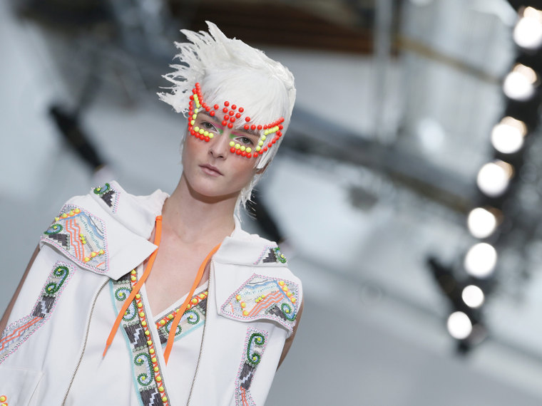 epa03884642 A model present a creation from the Spring/Summer 2014 Ready to Wear Collection by Indian designer Manish Arora during the Paris Fashion W...