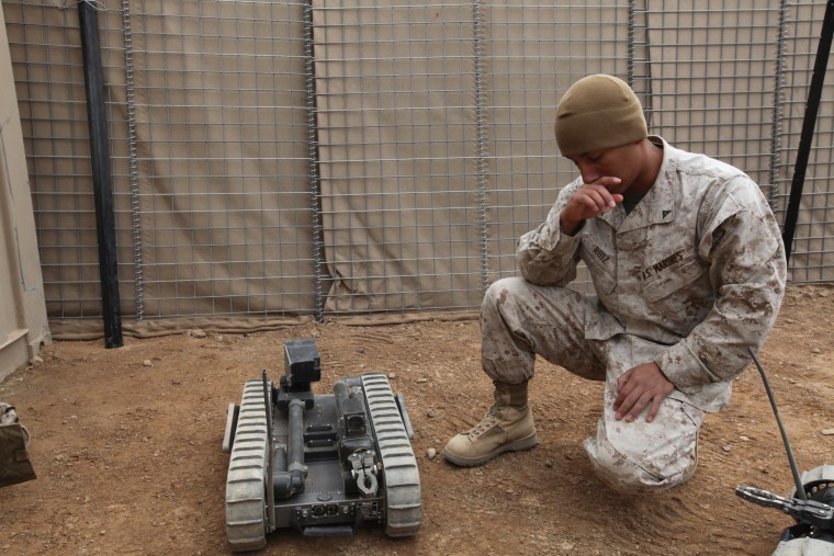 U.S. Marine Corps Lance Cpl. Alfredo Ruiz, assigned to 2nd Combat Engineer Battalion, 2nd Marine Division, briefs fellow Marines and U.S. Sailors on t...