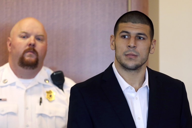 Aaron Hernandez, former player for the NFL's New England Patriots football team, stands during his arraignment in the Bristol County Superior Court in Fall River, Mass., on Sept. 6.