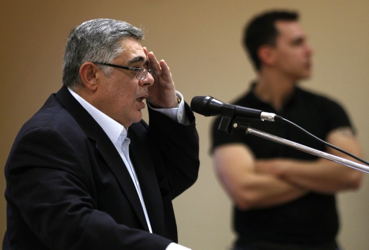 Leader of far-right Golden Dawn party Nikolaos Mihaloliakos addresses an election campaign rally in Perama, near Athens, on April 23, 2012. Greek police arrested Mihaloliakos and spokesman Ilias Kasidiaris on Saturday on charges of founding a criminal organisation.