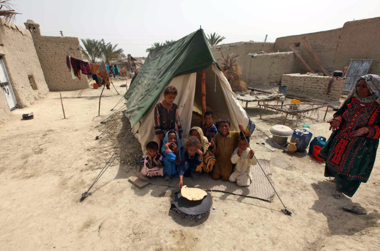 Earthquake survivors live in temporary shelters Saturday in Awaran, in Pakistan's Balochistan province.