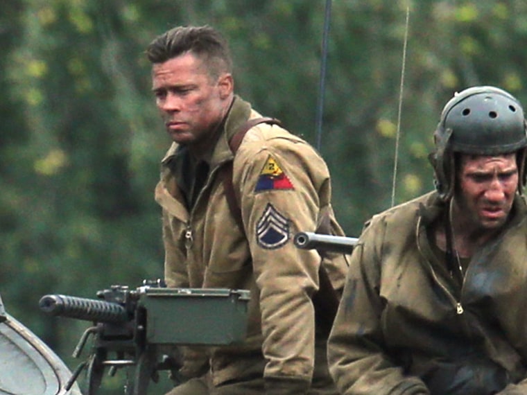 Brad Pitt and Shia LaBeouf are spotted aboard a tank on set of his new film 'Fury'.
<P>
Pictured: Brad Pitt
<P><B>Ref: SPL622707  300913  </B><BR/>
Pi...