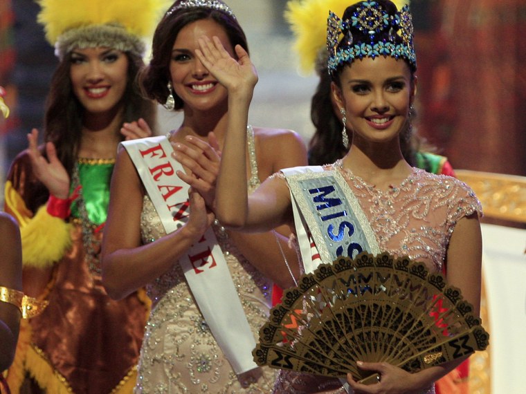 Newly crowned Miss World Megan Young of Philippine, centre, waves, after winning the Miss World contest,  in Nusa Dua, Bali, Indonesia, Saturday, Sept...