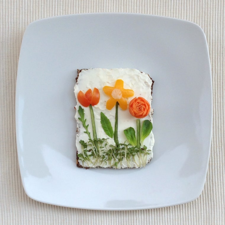 Image: Vegetable flowers on a bed of bread.