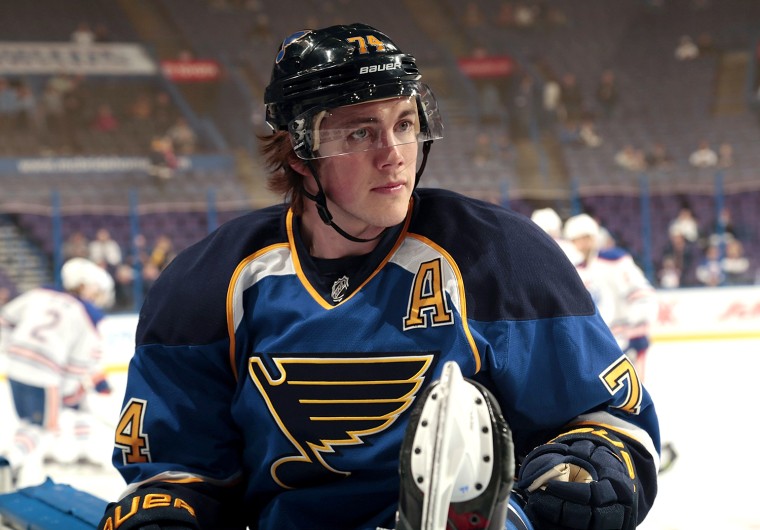 ST. LOUIS, MO - MARCH 13:  T.J. Oshie #74 of the St. Louis Blues stretches before an NHL game against the Edmonton Oilers on March 13, 2014 at Scottra...