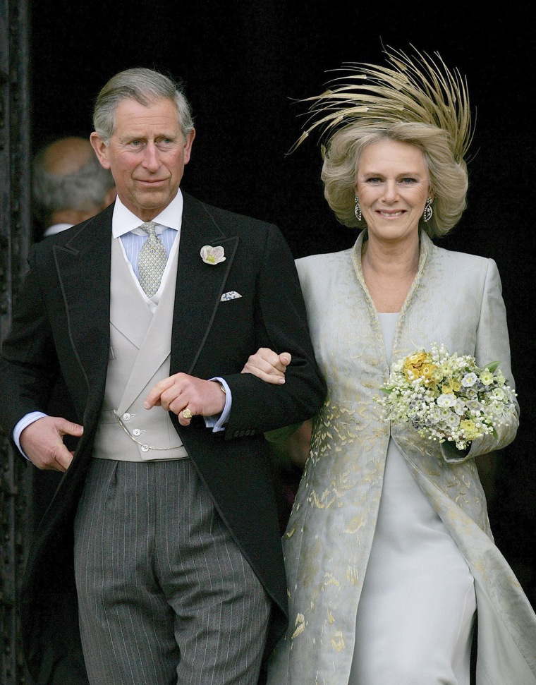 Britain's Prince Charles and his bride Camilla, Duchess of Cornwall leave St George's Chapel in Windsor following the church blessing of their civil w...
