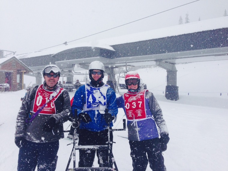 Patrick Zeigler, center, with the trainers -- from the National Disabled Veterans Winter Weather Sports Clinic in Snowmass, Colo. -- who helped him learn to ski.