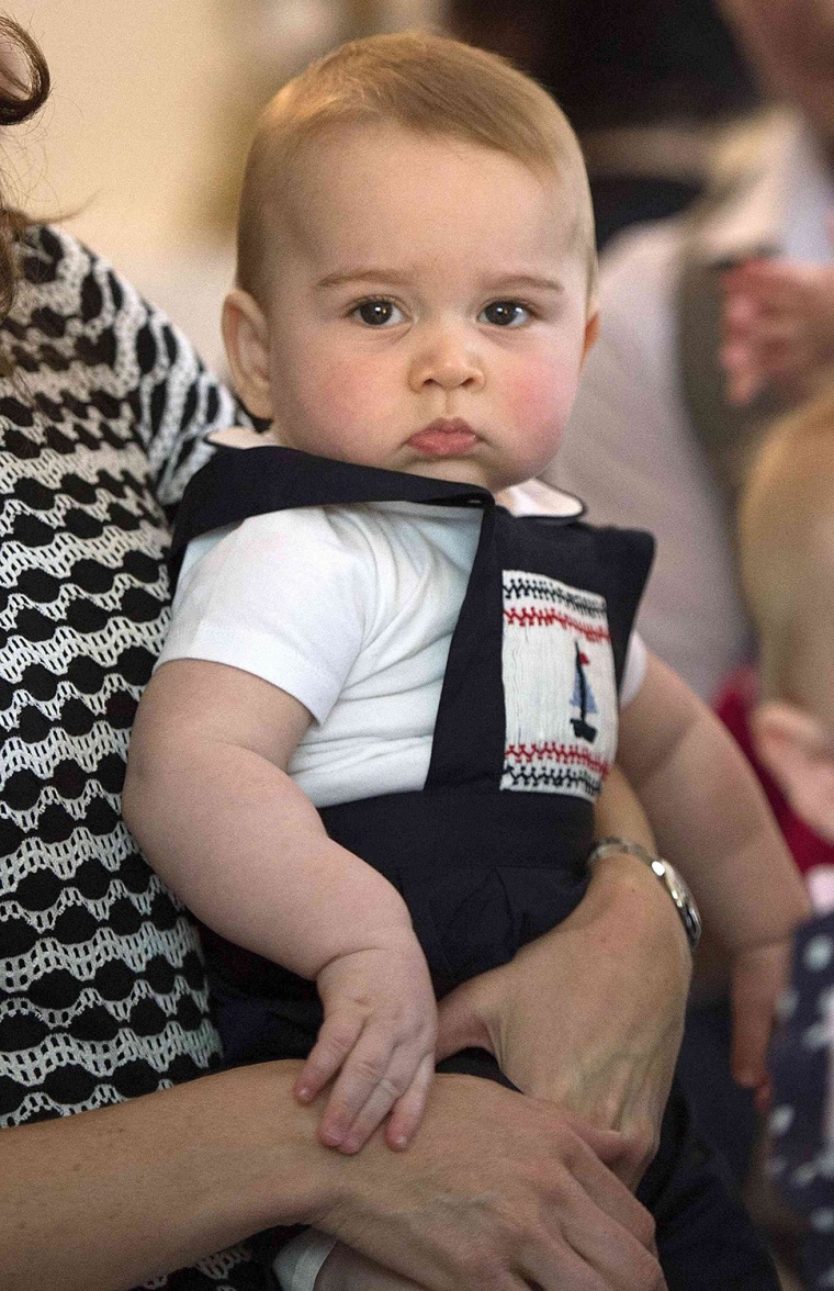 Britain's Prince George is seen while being carried by his mother Catherine, The Duchess of Cambridge, during a Plunket nurse and parents' group event...