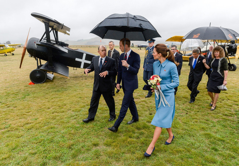 Britains Prince William and Catherine, Duchess of Cambridge get a tour from Graham Orphan (L) at the Omaka Aviation Heritage Centre, Blenh...