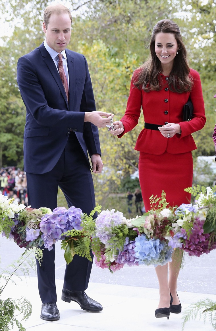 Catherine, Duchess of Cambridge, and her husband Britain's Prince William prepare to cut a \"flower ribbon\" as they officially open the Visitor's Centre at the Botanical Gardens in Christchurch, New Zealand.