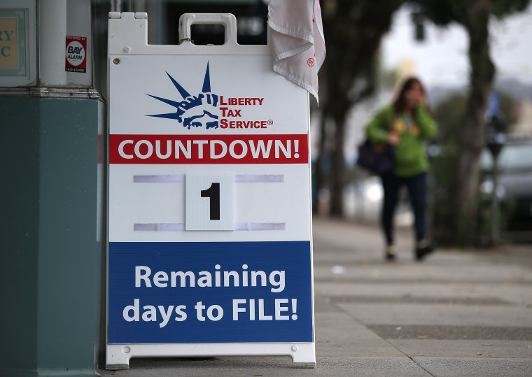 SAN FRANCISCO, CA - APRIL 14:  A sign advertising one day remaining before the tax filing deadline is posted in front of  Liberty Tax Service on April...