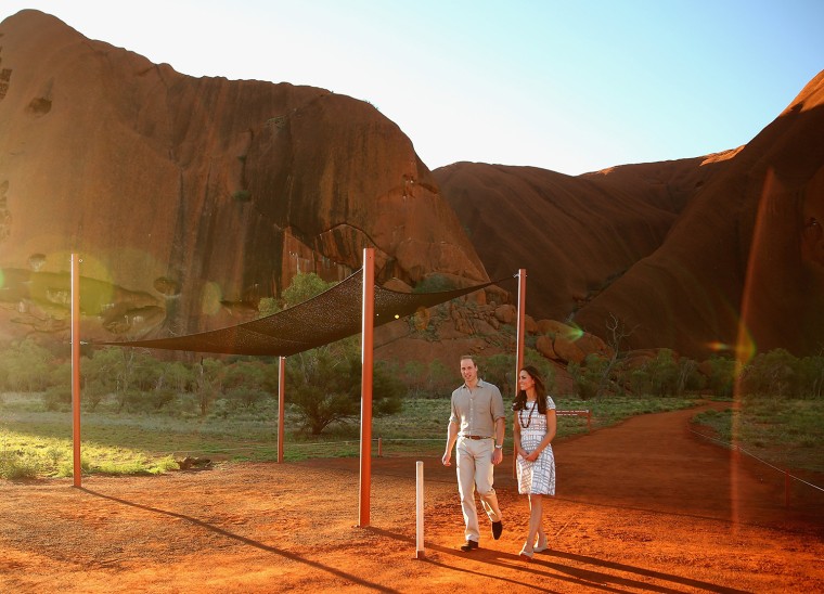 AYERS ROCK, AUSTRALIA - APRIL 22:  Catherine, Duchess of Cambridge and Prince William, Duke of Cambridge walk down Kuniya Walk at the base of Uluru on...
