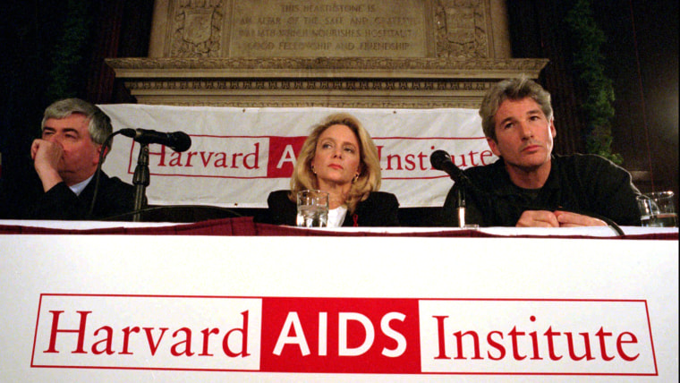 ** FILE ** Mary Fisher, center, Actor Richard Gere, right, and Harvard AIDS Institute Chairman Max Essex appear at an AIDS benefit event in Boston in ...