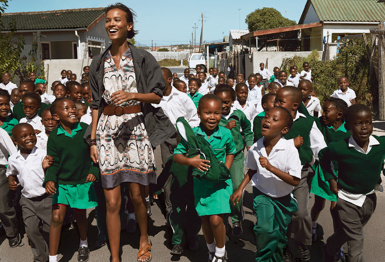 Liya Kebede, a designer for the Born Free Collection, with children from Ntwasahlobo Primary School in Cape Townâ€™s Khayelitsha township. Fabric desi...