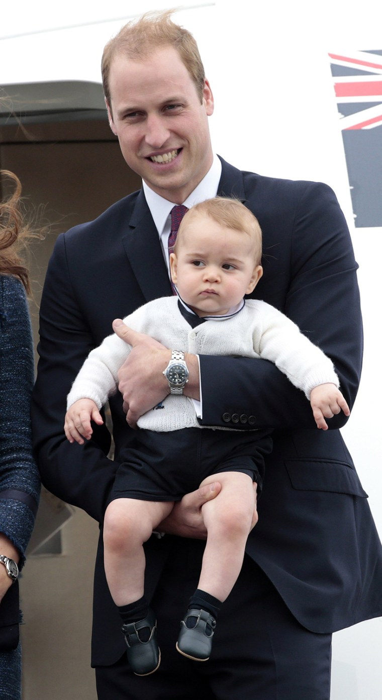 Britain's Prince William holds Prince George