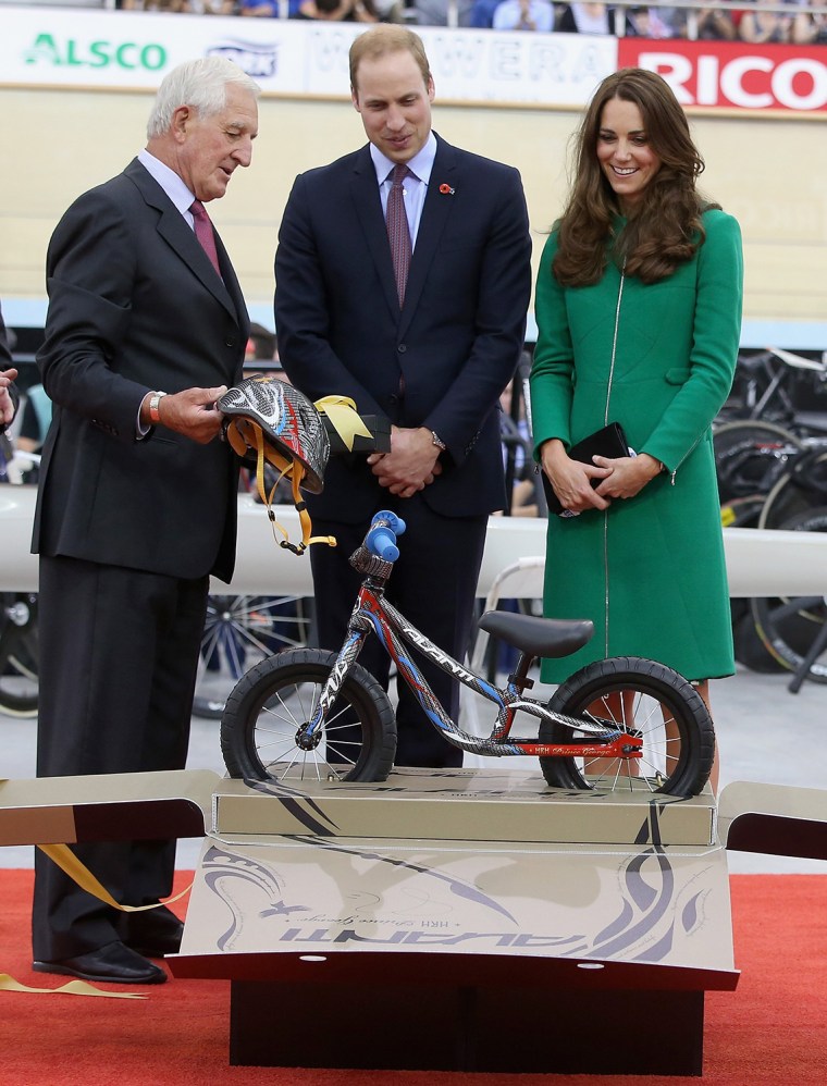 Prince William and Duchess Kate are presented with an Avanti mini bike for Prince George.