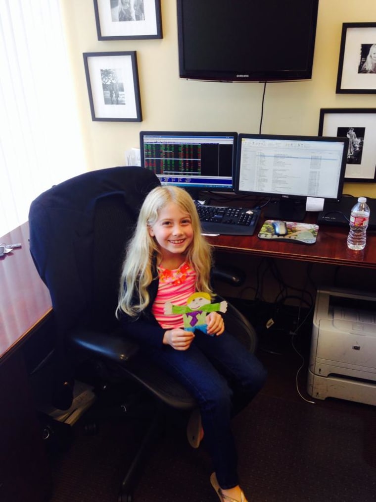 Lilly taking \"Flat Stanley\" to work with daddy David Galluccio.