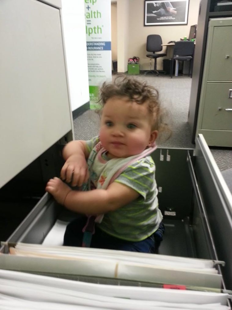 Aava at work with me and deciding it was more fun in the file cabinet.