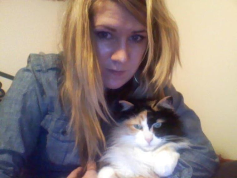 Author and photographer Alexandra Crockett is pictured with her former cat Suknukoon, who may have been eaten by a coyote in the Pacific Northwest.