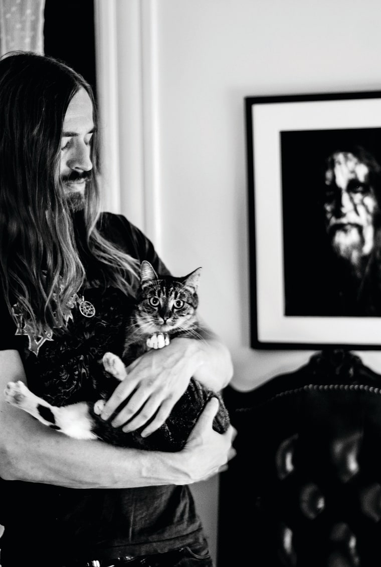 Brett Hanson of the band Evil Slime is pictured with his cat, Abigail.
